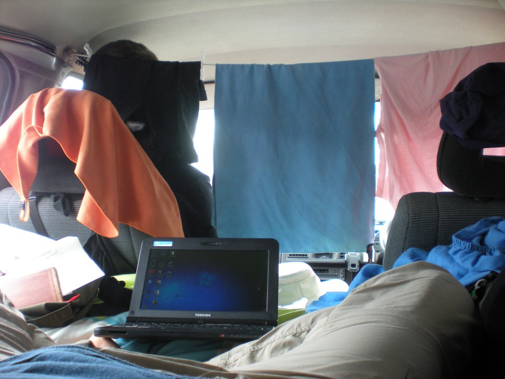 working area inside the hippie van - an indoor clothesline is part of the system for how to live in a van or RV living