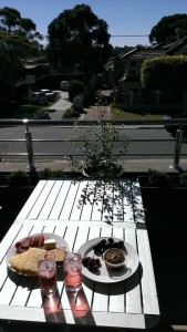 Picnic on the balcony at beach-tour-guide's house enjoying the results of our home improvement efforts!