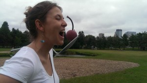 sculpture park minneapolis minnesota woman biting a cherry on a spoon