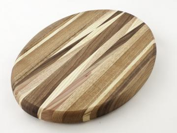 round wooden cutting board with diagonal patterns