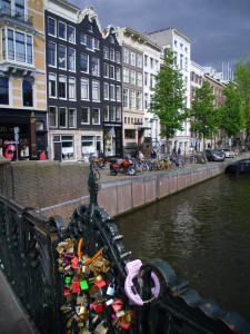 amsterdam locks bridge canal houses