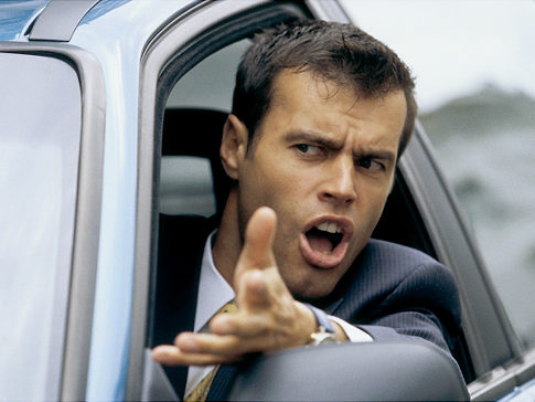 angry exasperated man driving car