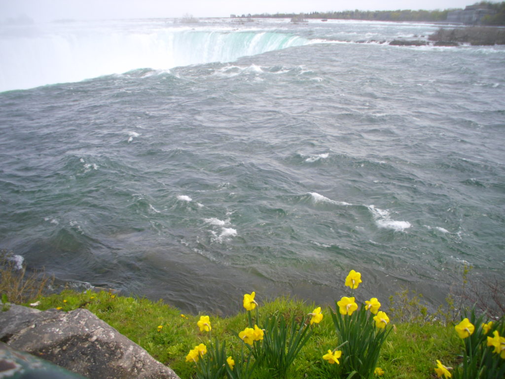 Go up to the edge of Horseshoe Falls on the Canadian side of Niagara Falls for a breathtaking experience as photographed by top travel blog Half the Clothes' author Jema Patterson