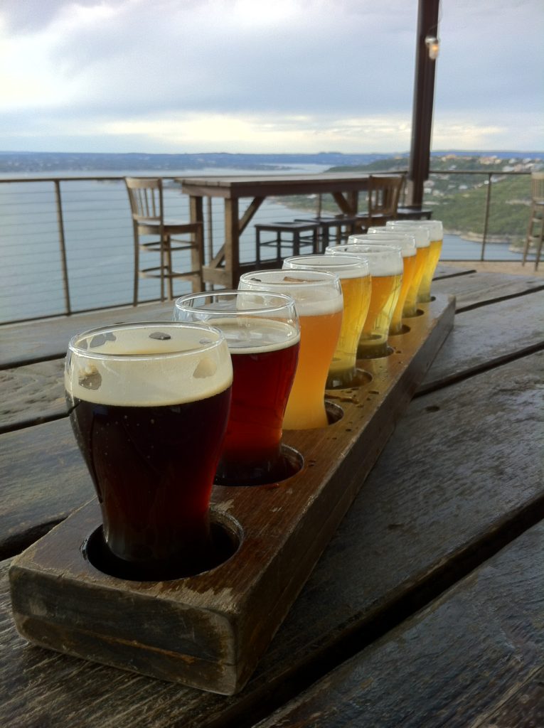 Oasis Brewery overlooking Lake Travis in Austin, Texas' hill country. where slow travel expert at Half the Clothes slow travel blog went with a local Austinite